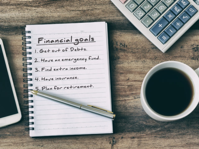financial goal written on notepad