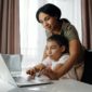 woman and child using laptop