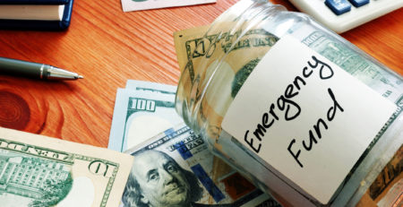 emergency fund in the glass jar with cash