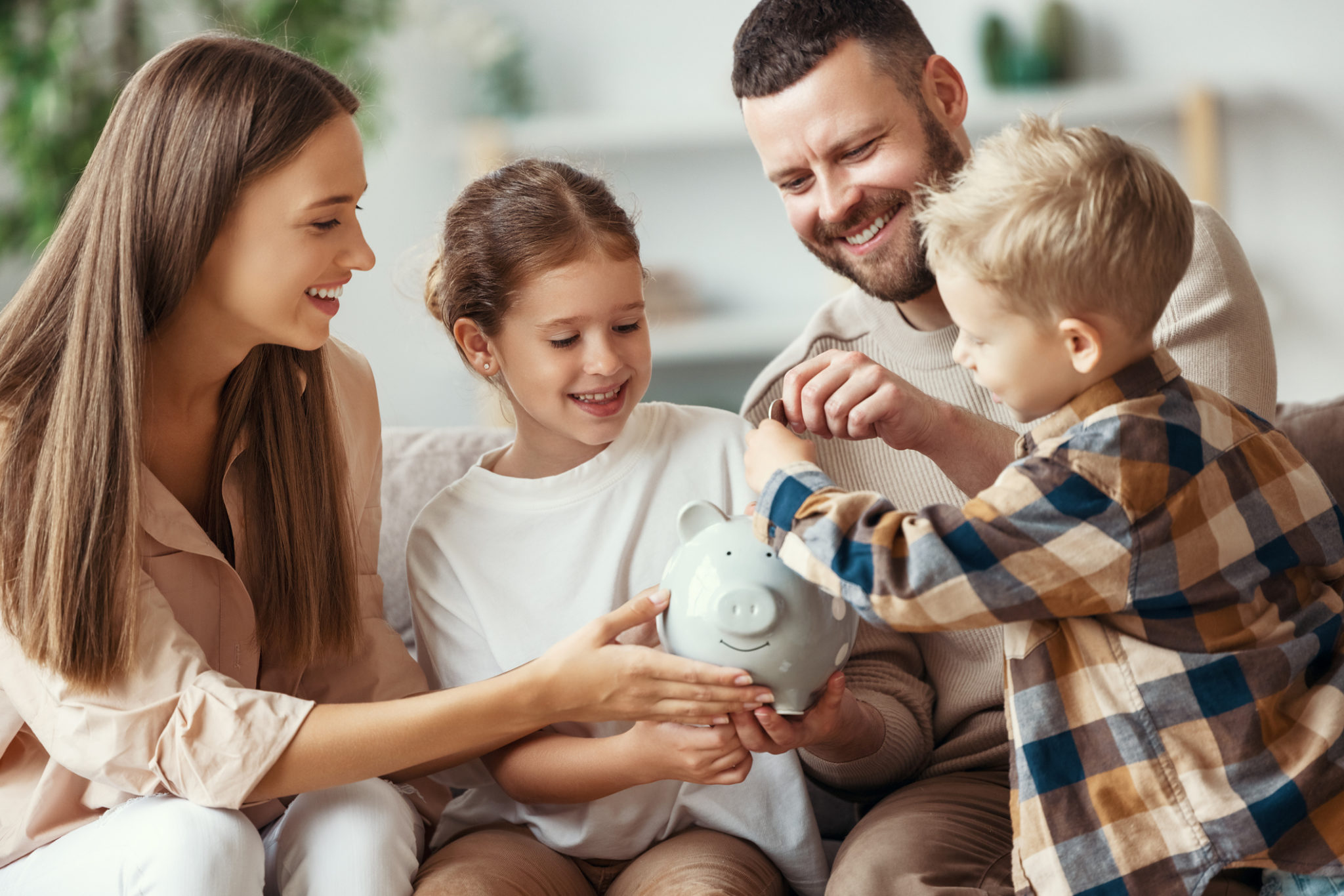 family with piggy bank at home